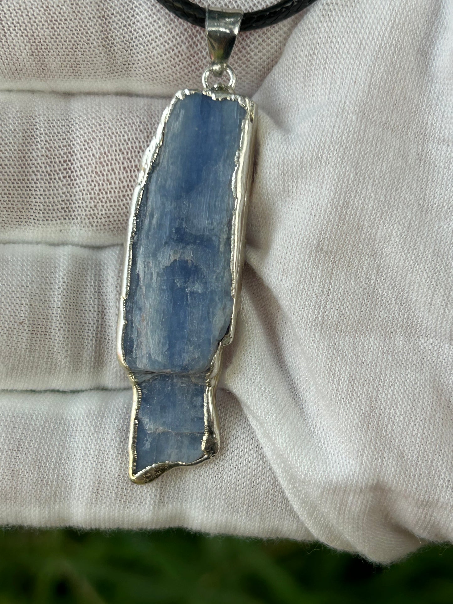 raw irregular shaped apatite pendant in hand made silver setting
