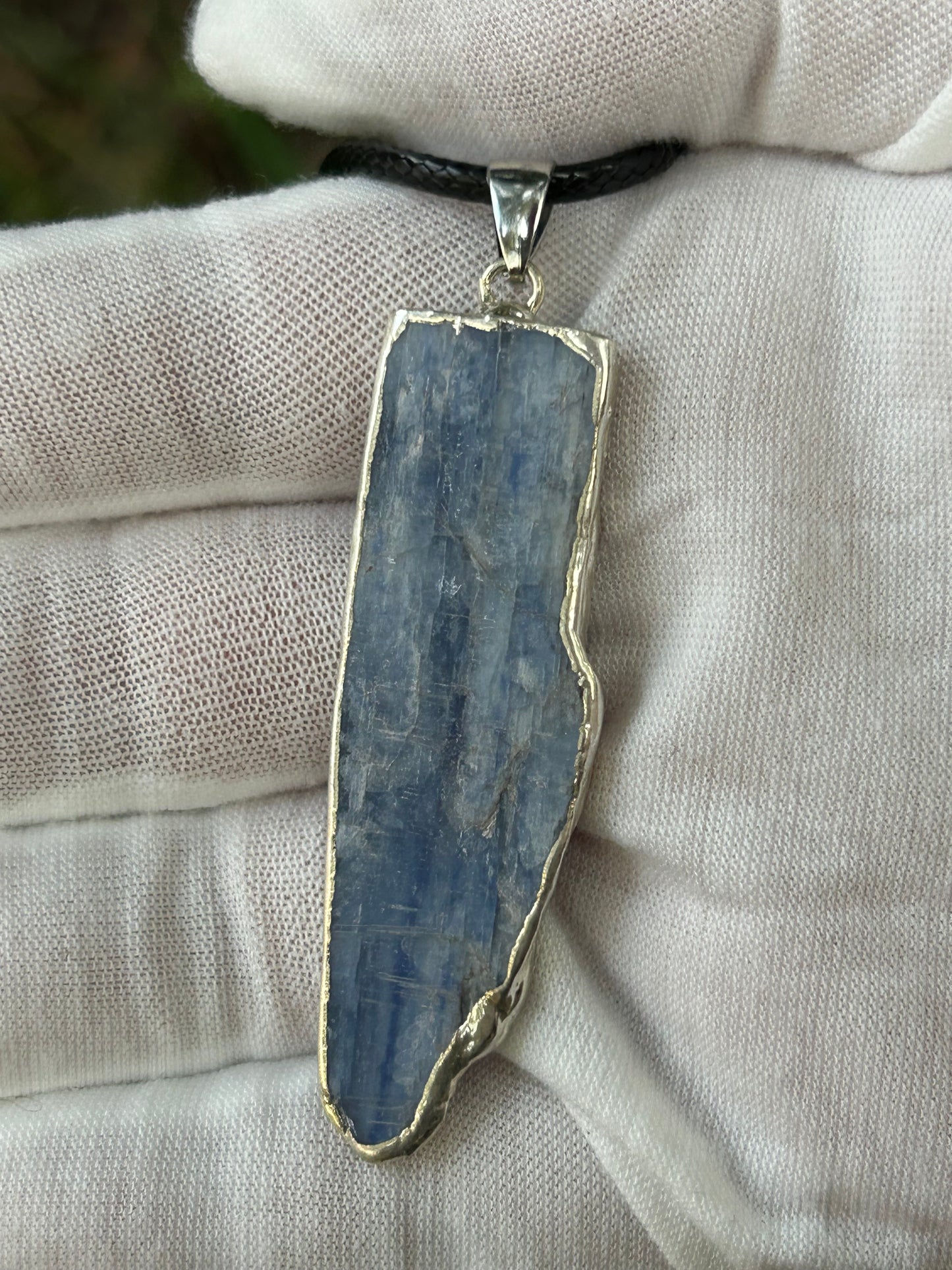 raw irregular shaped apatite pendant in hand made silver setting