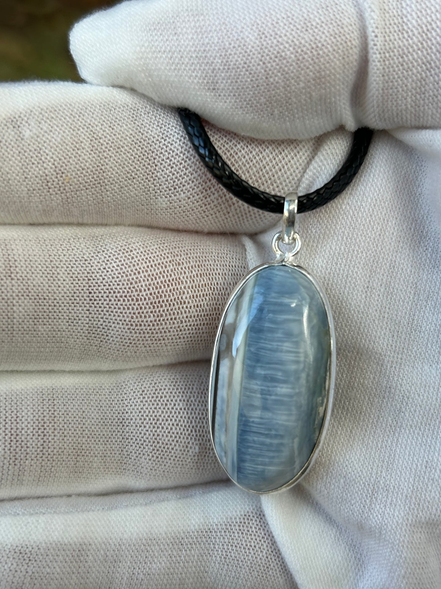 Oval Blue Opal set in925 Sterling Silver Pendant.