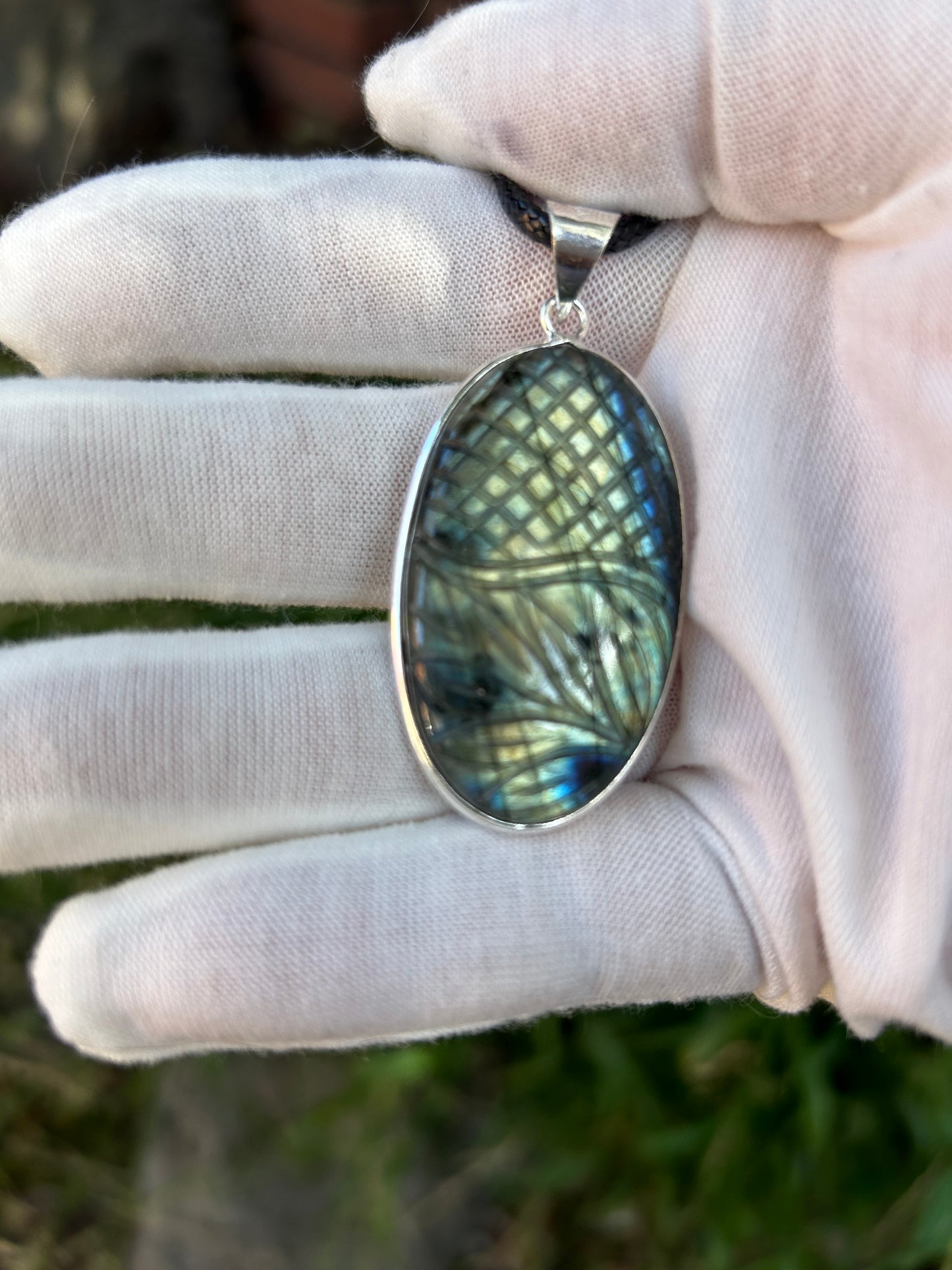 Carved blue flash green flash oval Labradorite pendant Sterling Silver setting