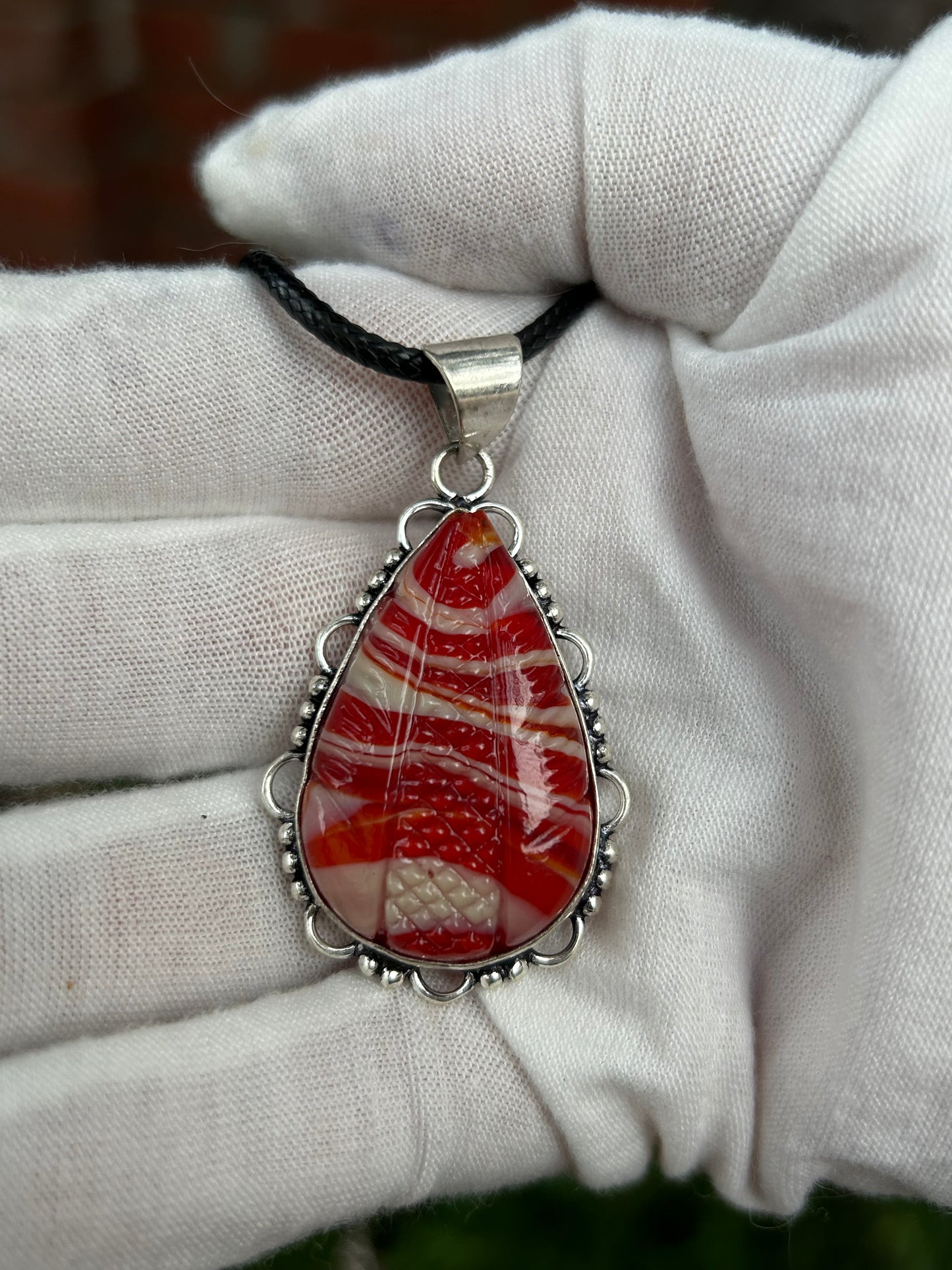 Red striped Agate Handmade Carved Pendant set in unique sterling silver design