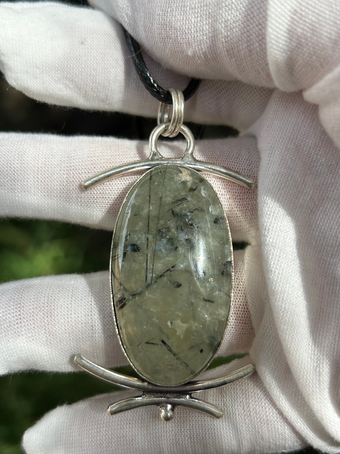 Green Prehnite crystal oval shaped pendant set in unique silver design