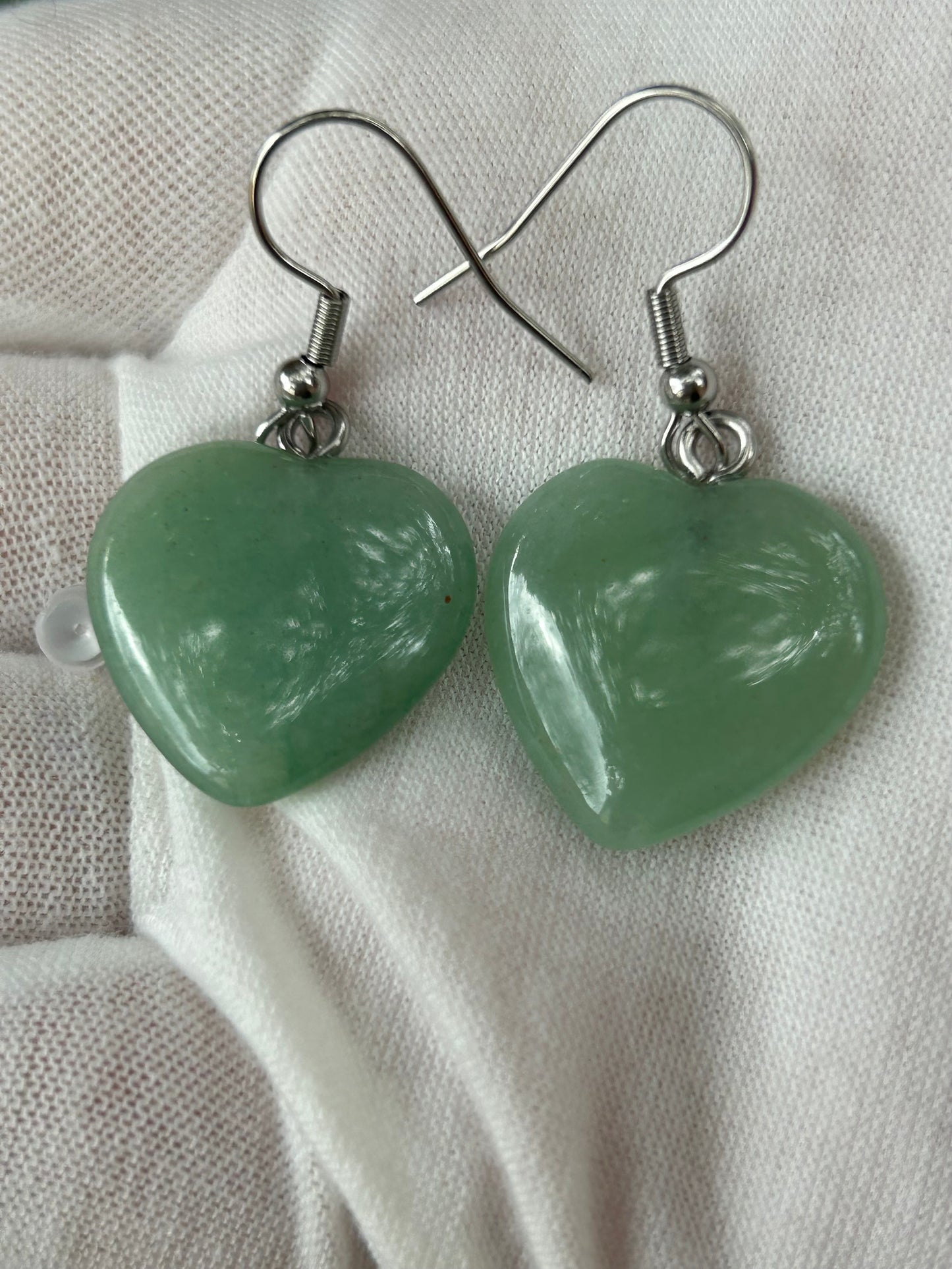 Green aventurine crystal polished heart shaped drop earrings with silver attachments