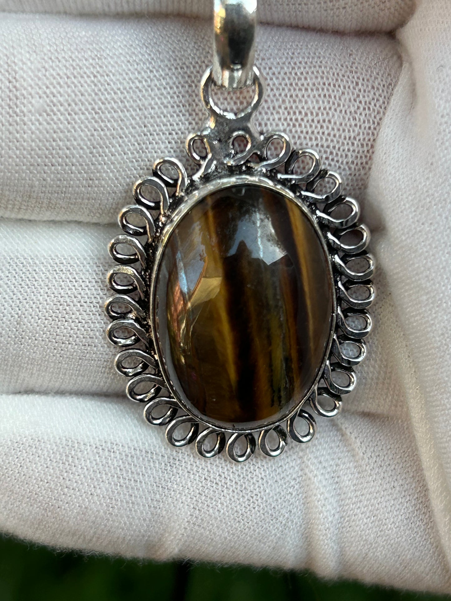 Tigers Eye Oval Pendant Set in ornate Antique Silver