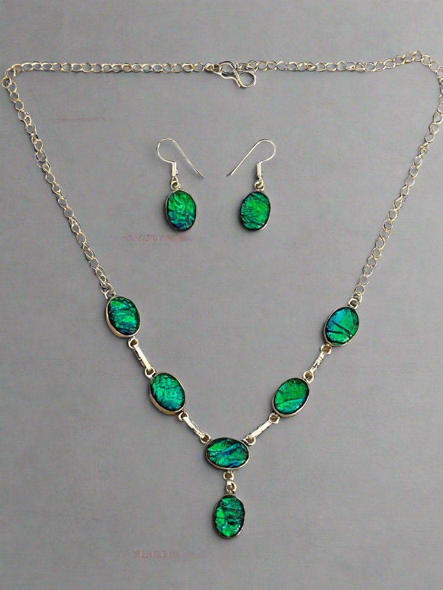Ammolite and sterling silver necklace and earrings set. The necklace has 6 ammolite gems and the earings have one gem each