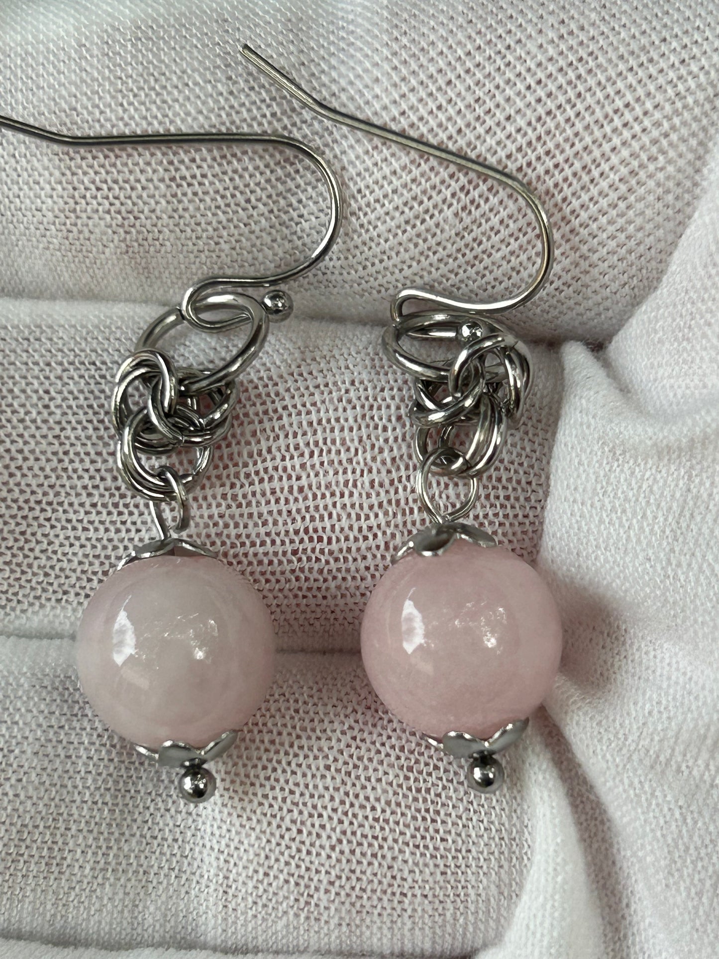 small round rose quartz crystal polished bead dangle earrings with silver detail