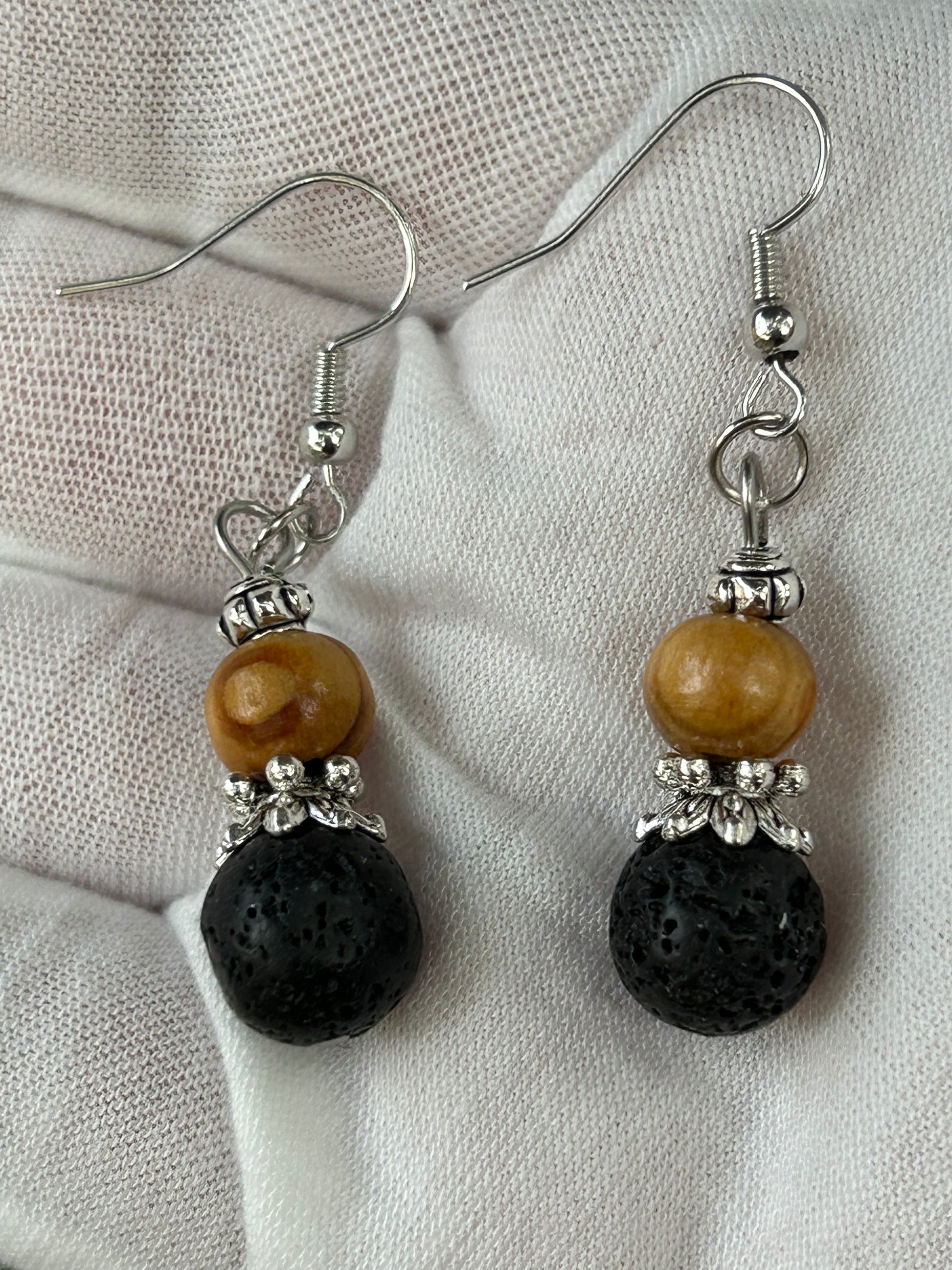 round black lava and wooden bead drop earrings with silver embellishments