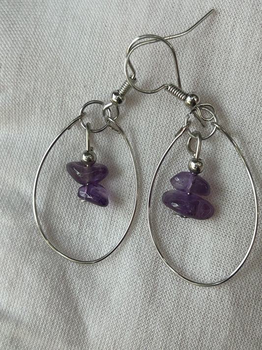 Amethyst  polished chips earrings with silver memory wire oval surrounding