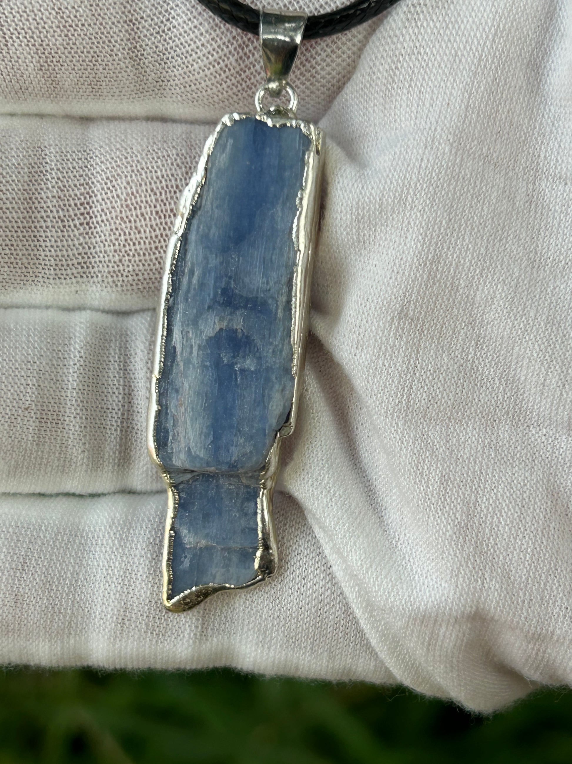 raw irregular shaped apatite pendant in hand made silver setting 