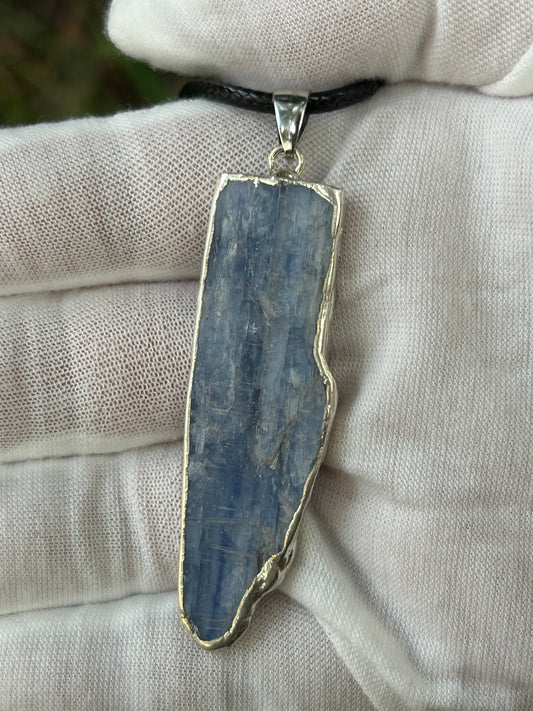 raw irregular shaped apatite pendant in hand made silver setting 