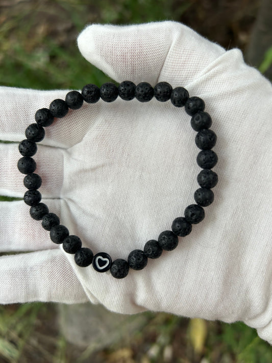 Lava rock bead bracelet with white heart detail