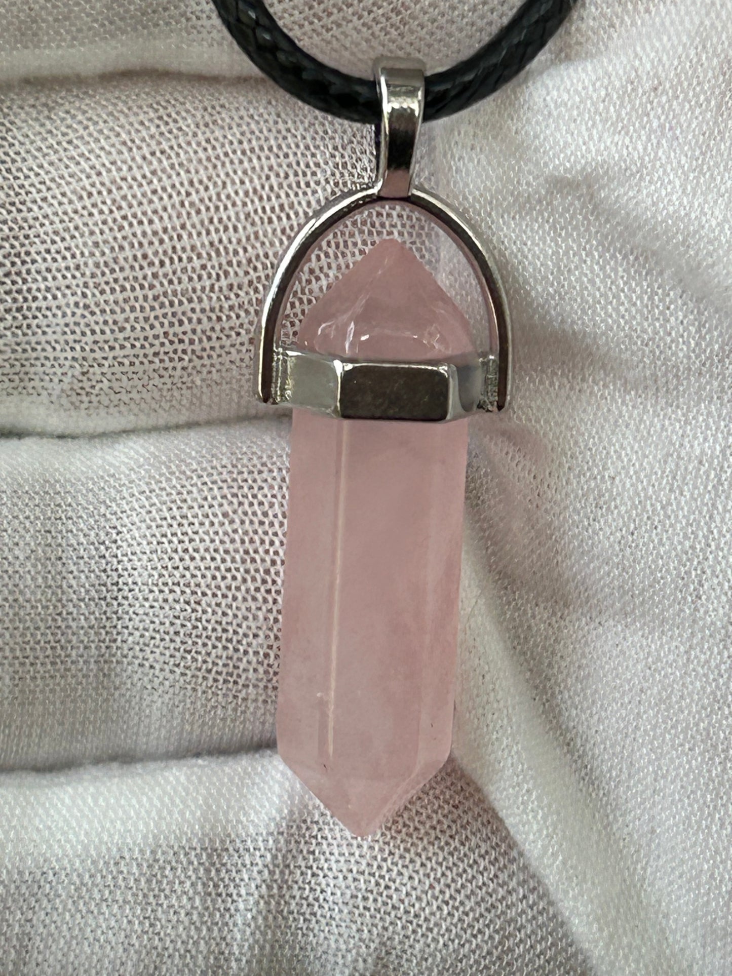 rose quartz crystal double point pendant with silver setting and black cord necklace