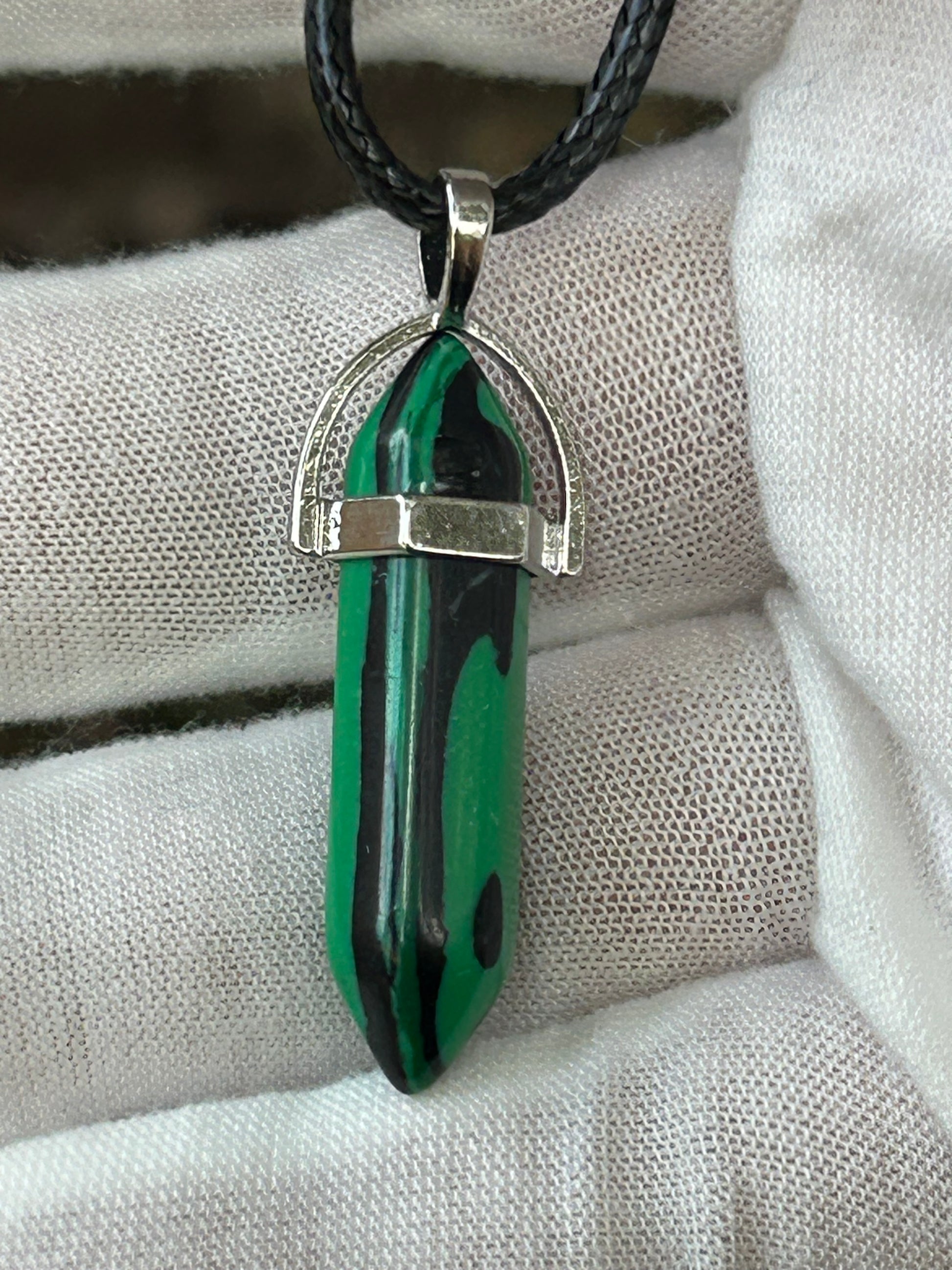 Malachite double point pendant with silver setting and black cord necklace