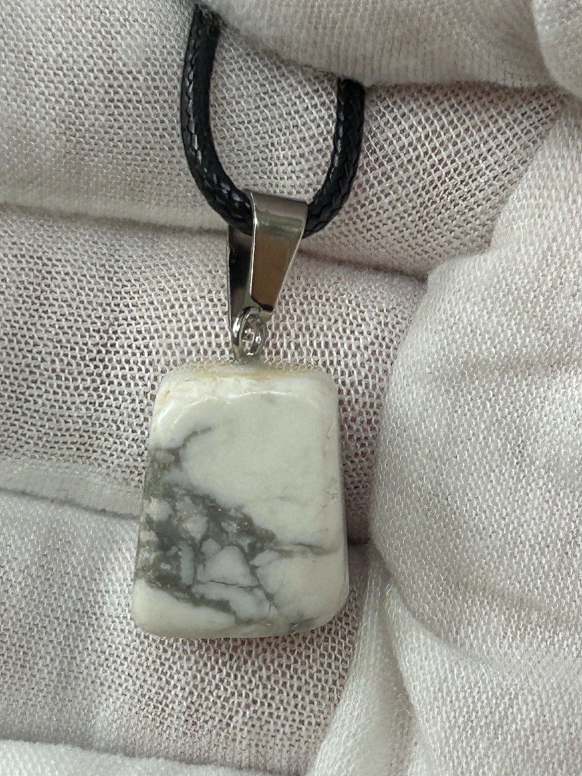 small howlite square polished pendant with silver attachment and black cord necklace