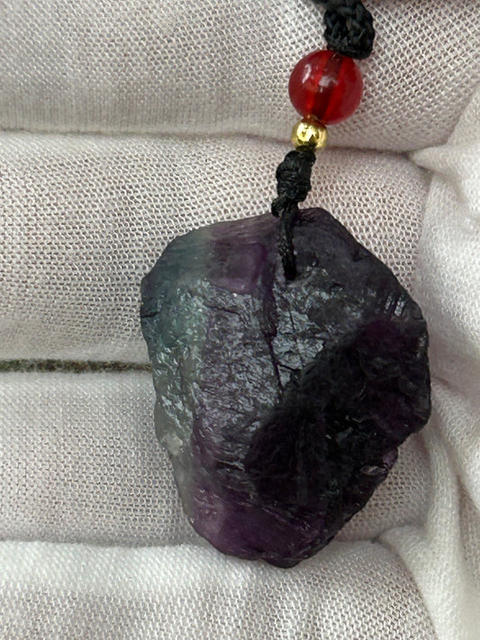 Raw rainbow fluorite green purple tones red bead and black cord adjustable necklace