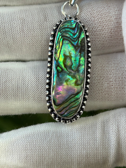 Brightly coloured Paua Abalone Shell Pendant in unique sterling silver setting