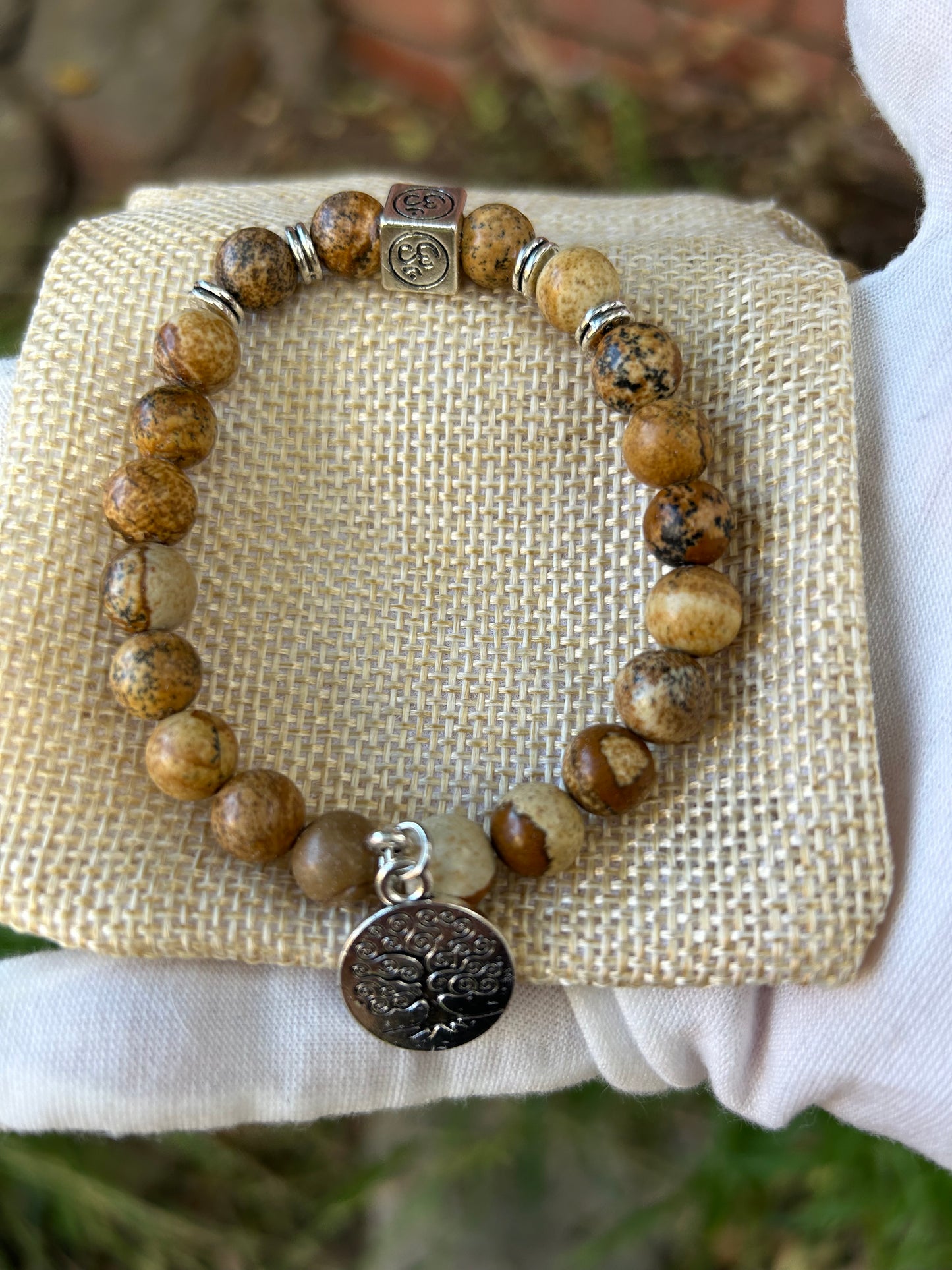 Jasper bead bracelet with silver detail, Om symbol and Tree of Life charm