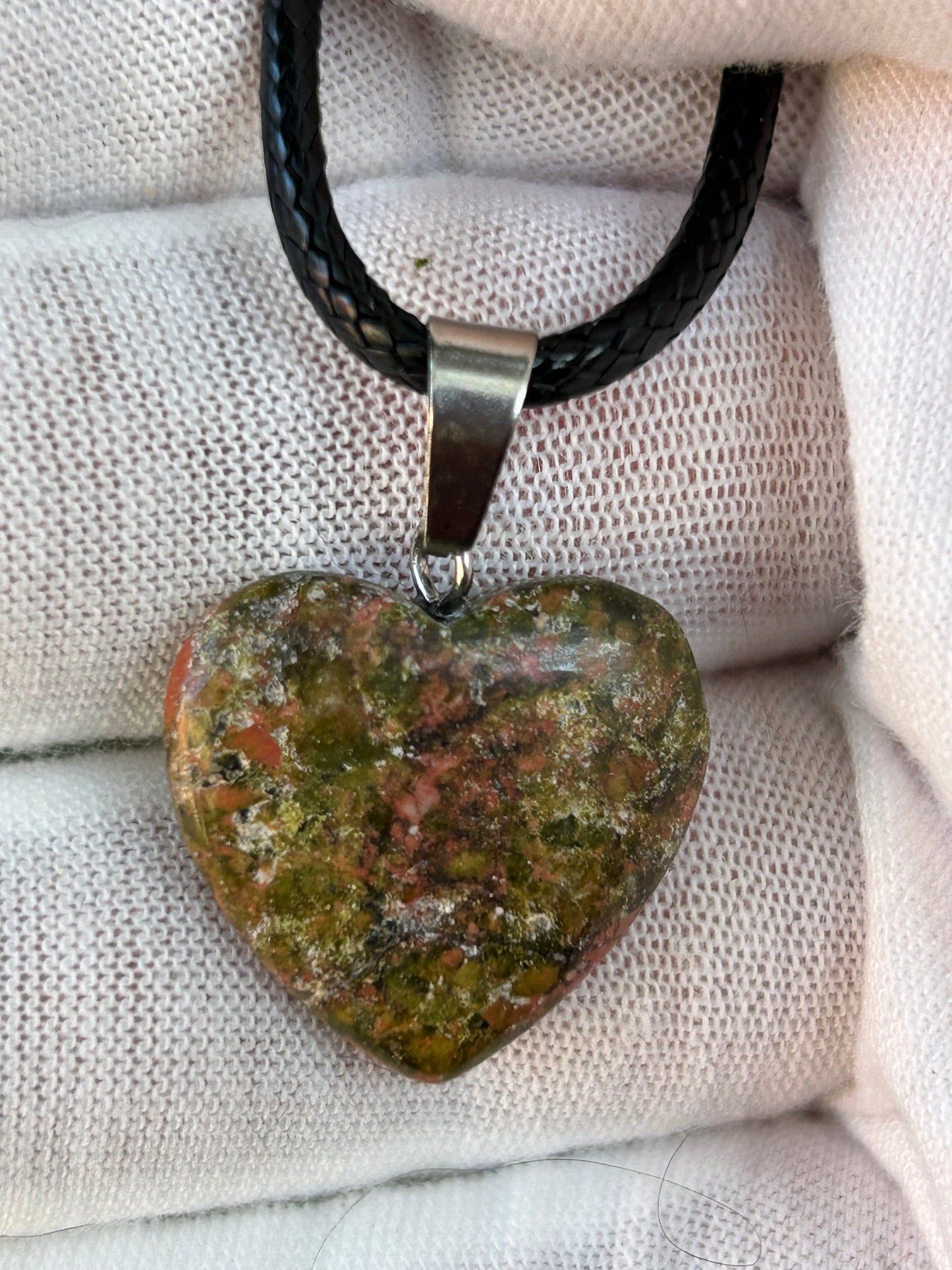 Unakite Polished Heart Pendant with silver pendant attachment and black cord necklace