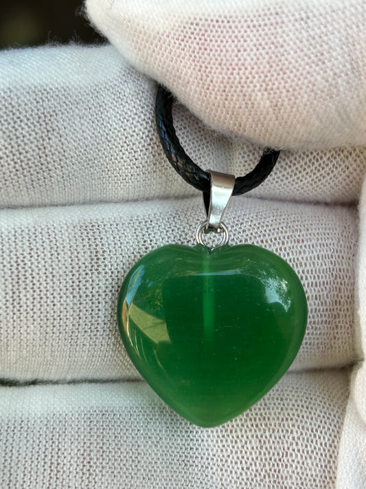 Green Agate polished heart crystal pendant with silver pendant attachment and black cord necklace