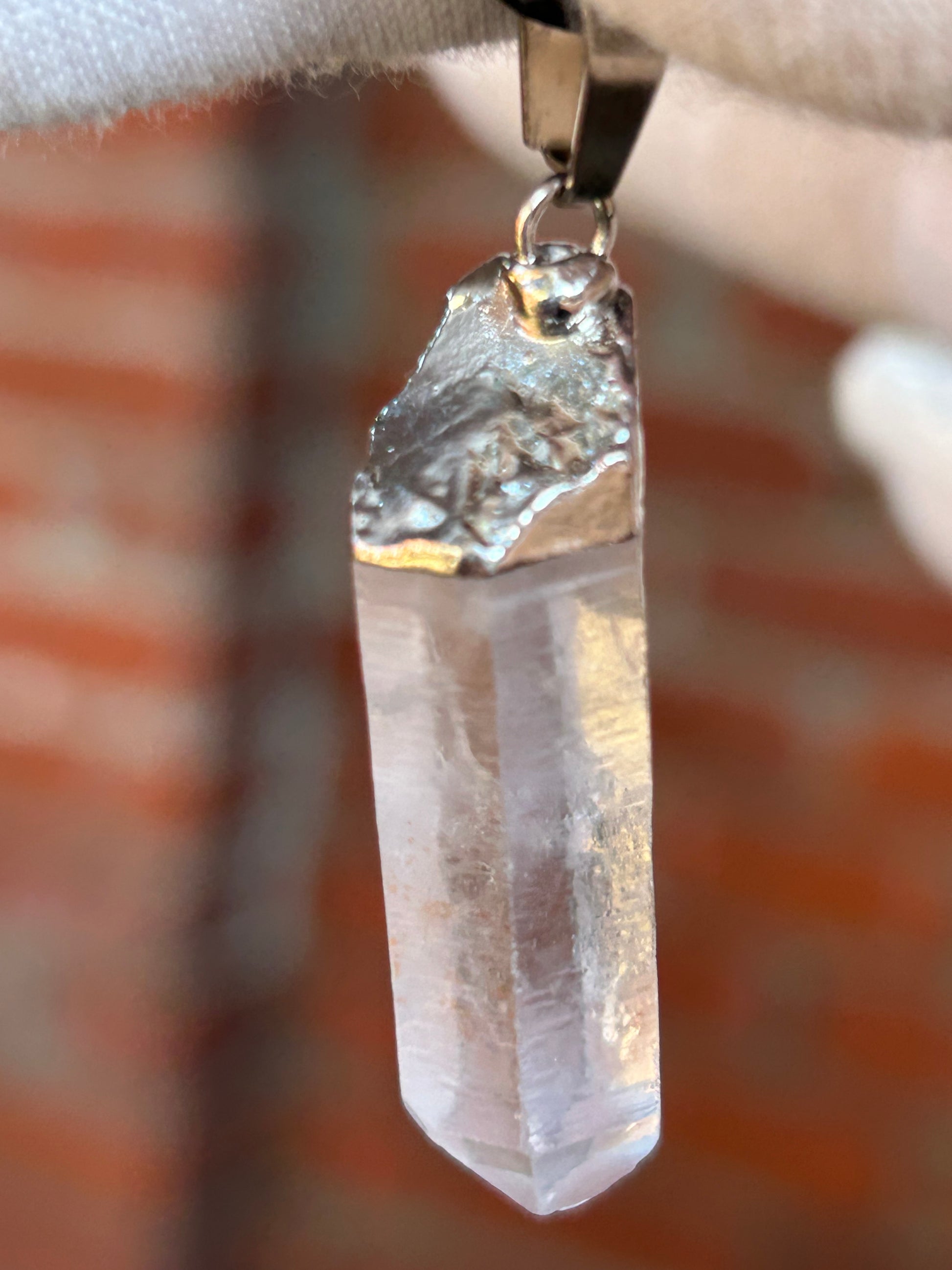 clear quartz shard pendant with rustic silver attachment