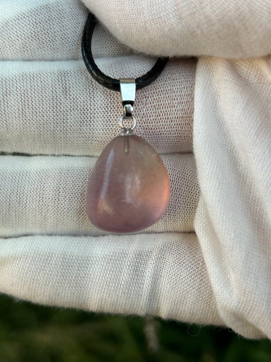 small fluorite irregular shape polished pendant with silver pendant attachment and black cord necklace