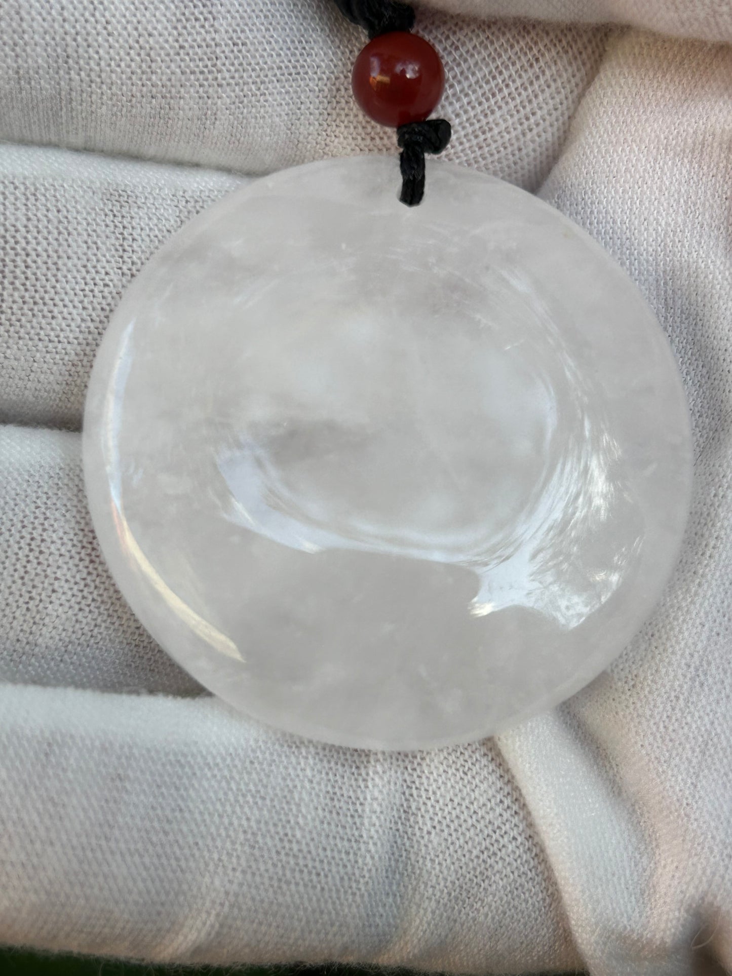 Large Clear Quartz Circular Pendant with red bead and black cord necklace