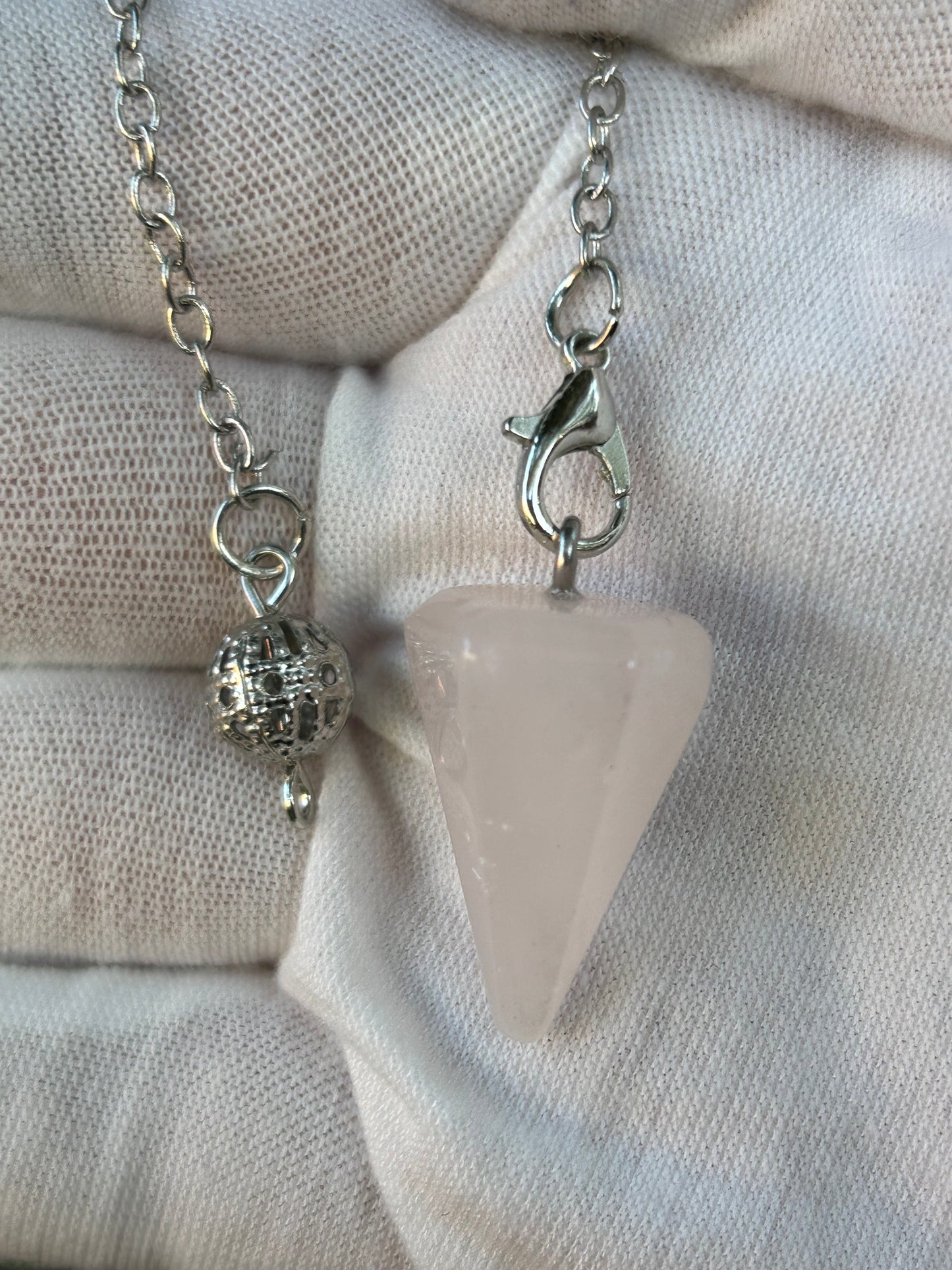 Rose quartz crystal pendulum with silver chain
