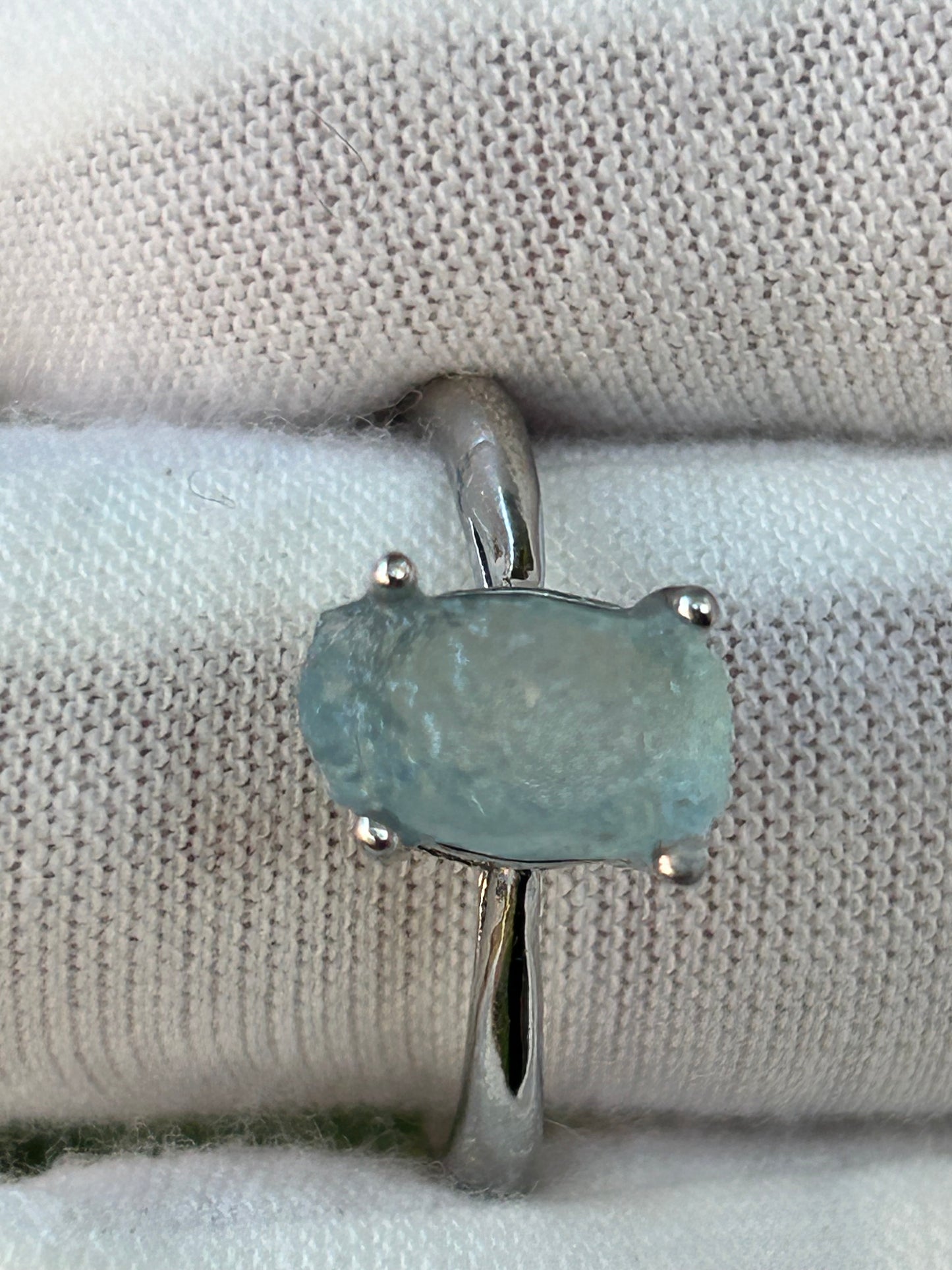 Small raw aquamarine set in silver adjustable ring