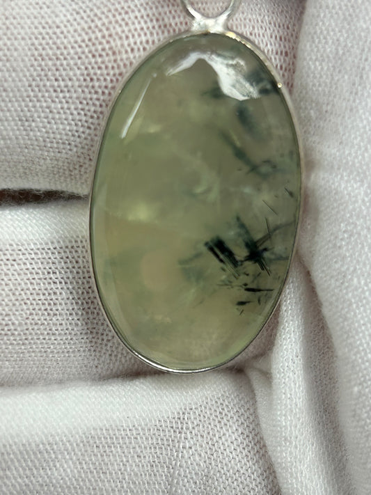 Green Prehnite crystal  oval shaped pendant set in silver 