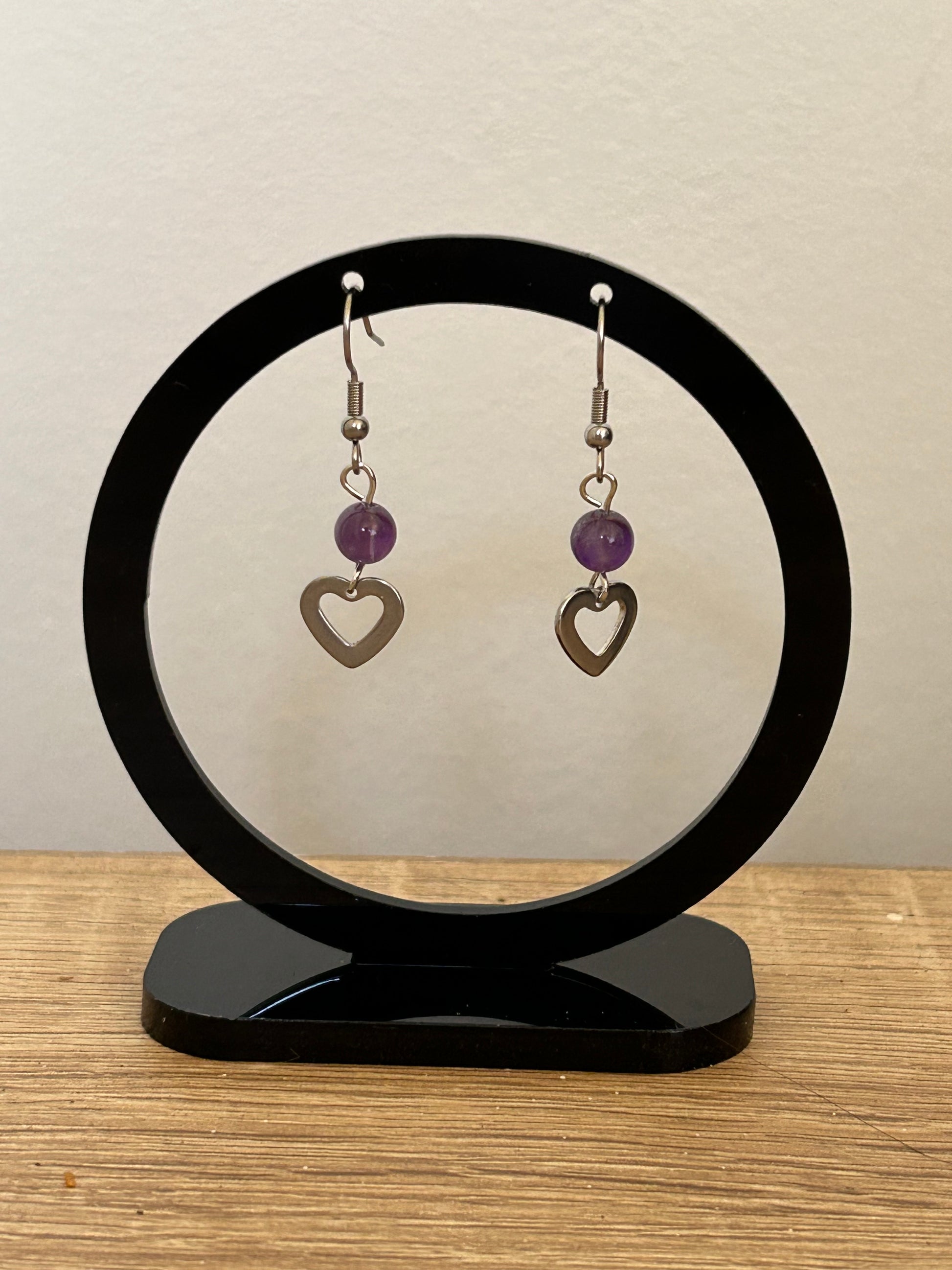 Polished amethyst crystal bead and silver heart drop earrings