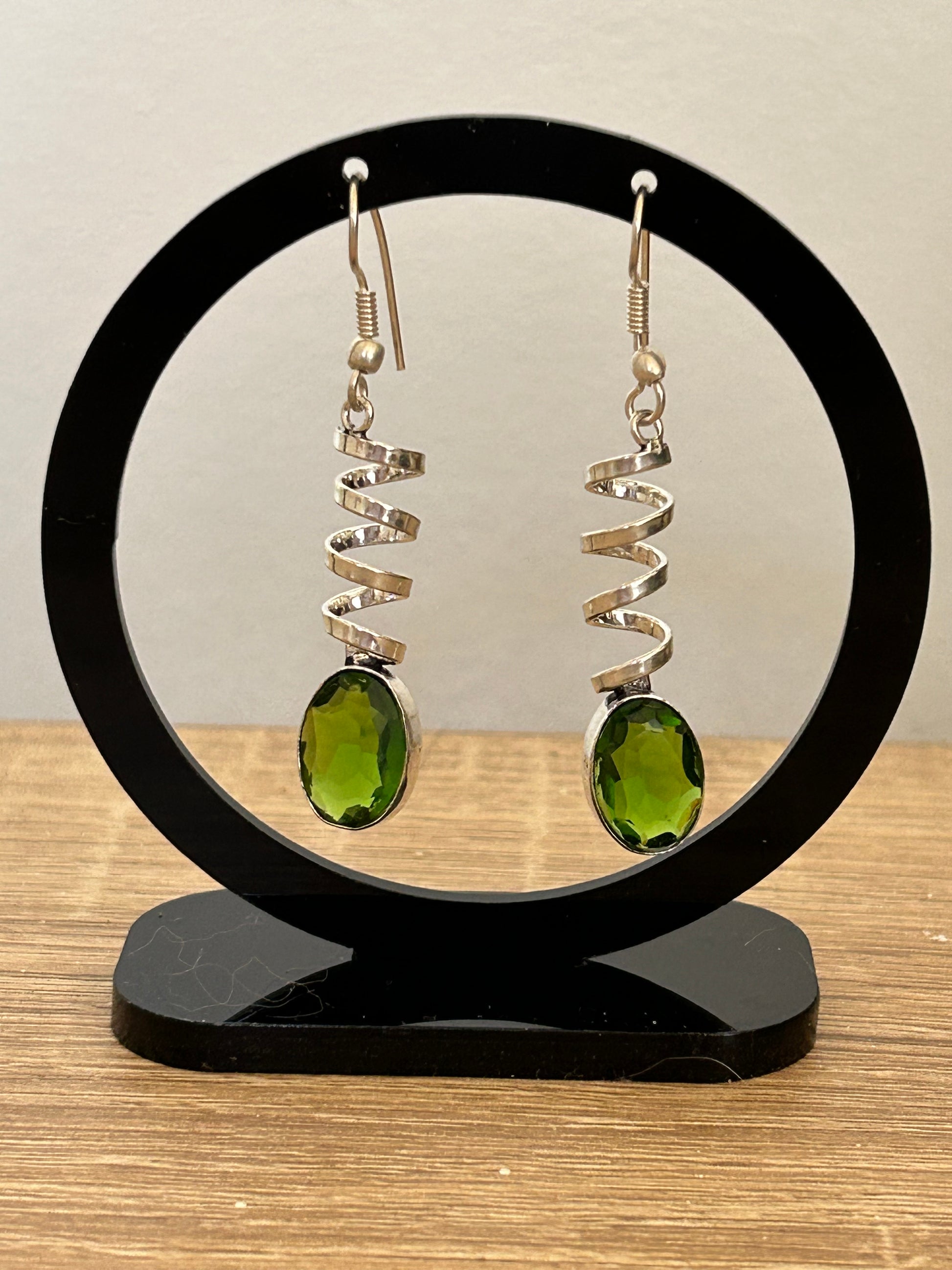 Handmade faceted oval green emerald crystal drop earrings and spiral sterling silver design