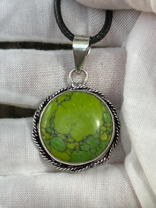 Handmade green turquoise round pendant in sterling silver setting