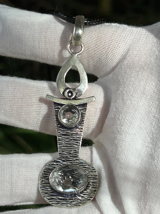 Faceted Mozambique crystals set in artistic textured handmade sterling silver pendant