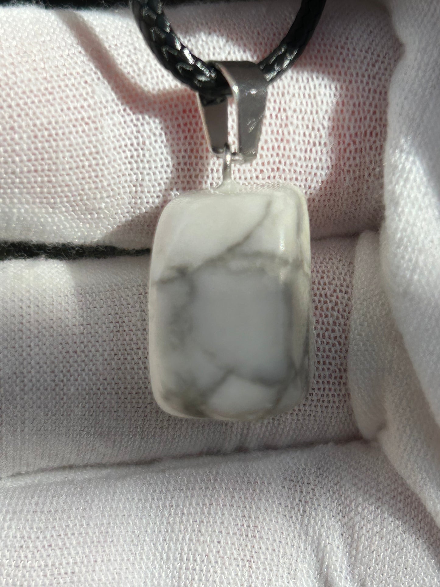 small howlite square polished pendant with silver attachment and black cord necklace
