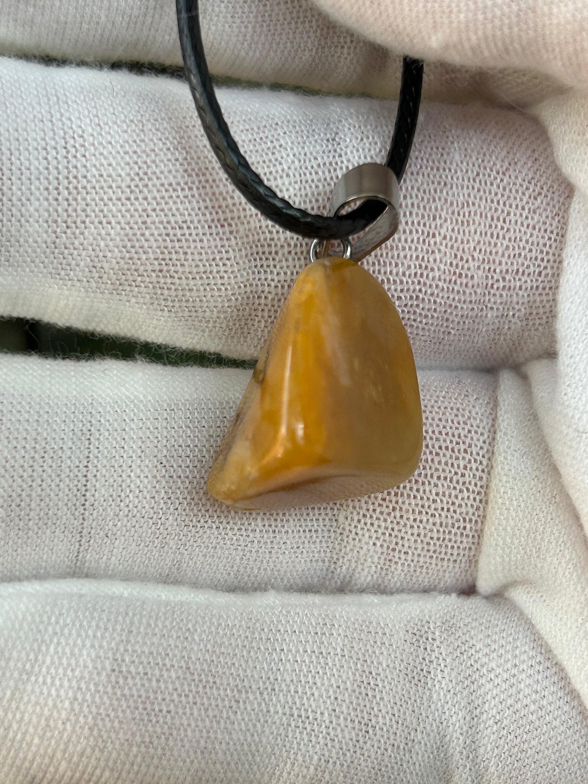 Irregular shape Topaz Jade Polished Stone Pendant with silver pendant attachment and black cord necklace