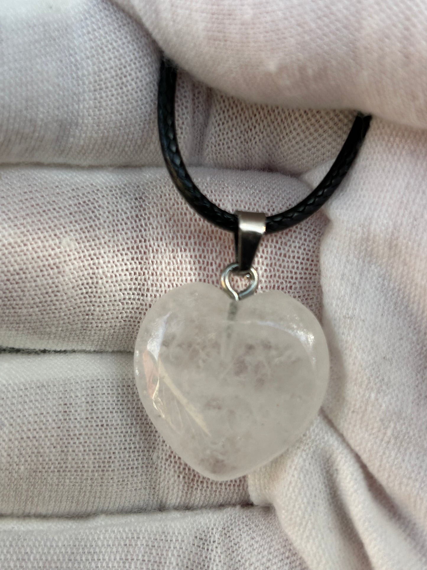 Clear Quartz Polished Heart Pendant with silver pendant attachment and black cord necklace