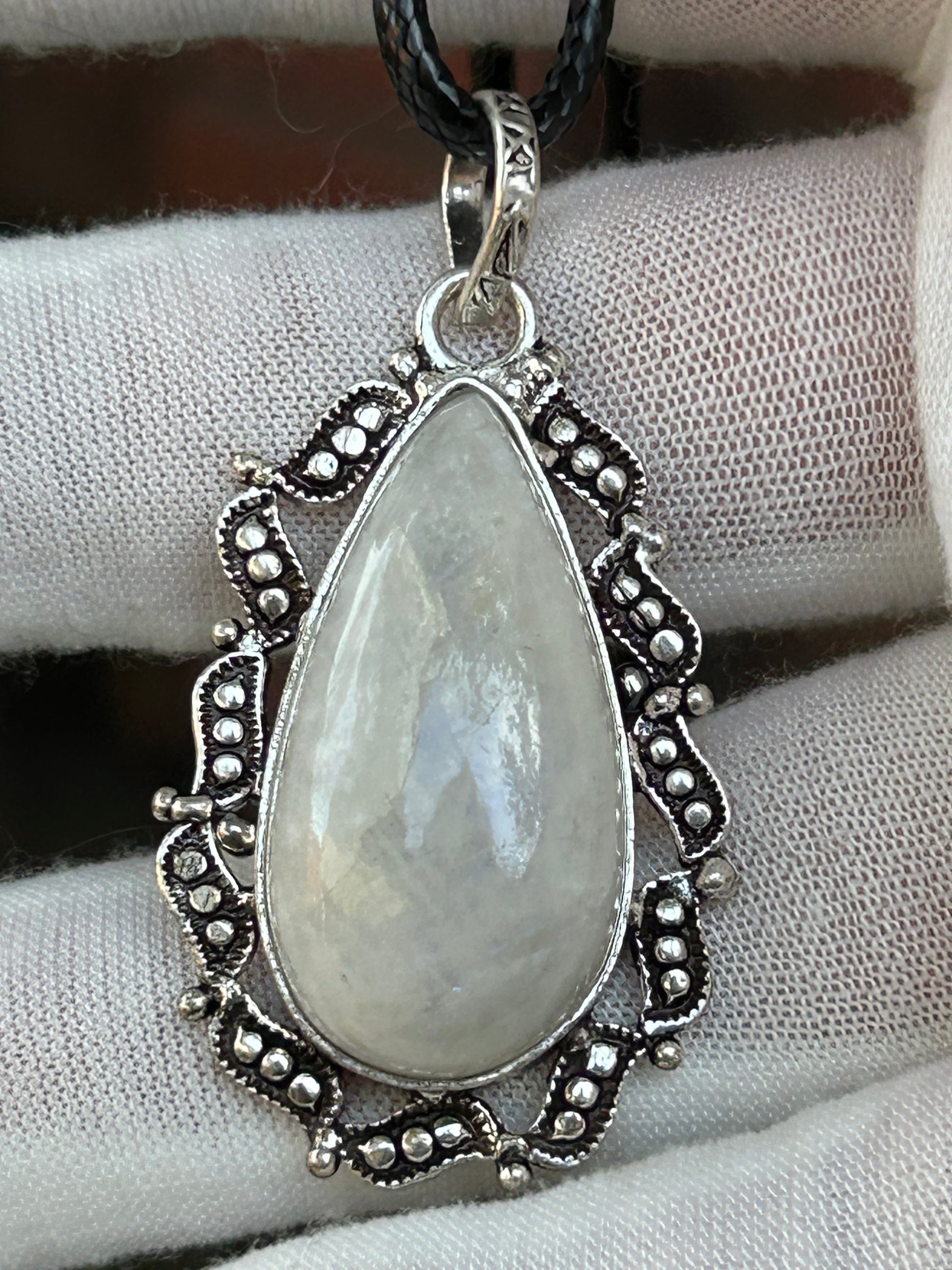 Handmade moonstone tear drop raindrop pendant intricate sterling silver setting unique 