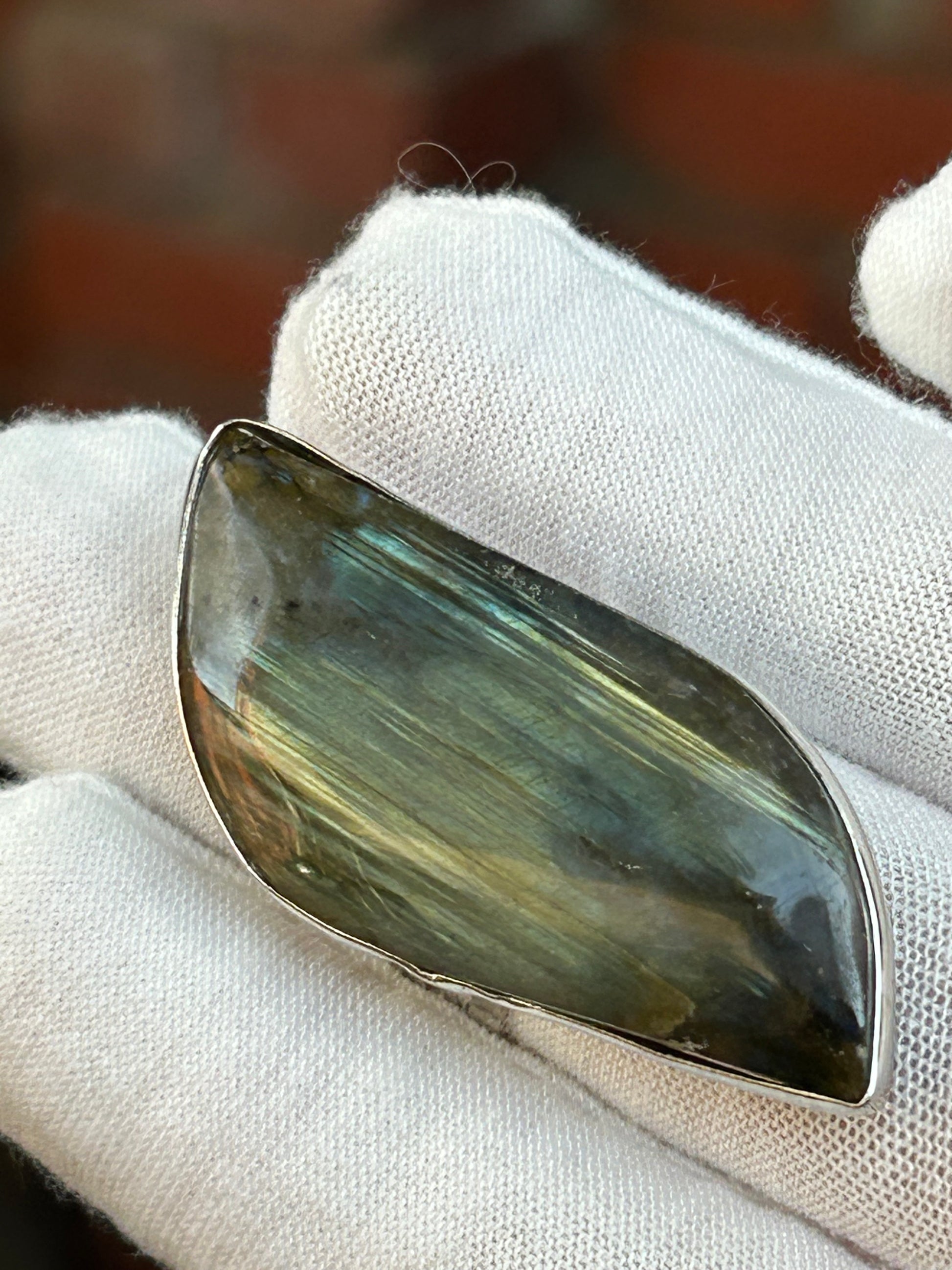 Large labradorite green flash adjustable ring set in silver