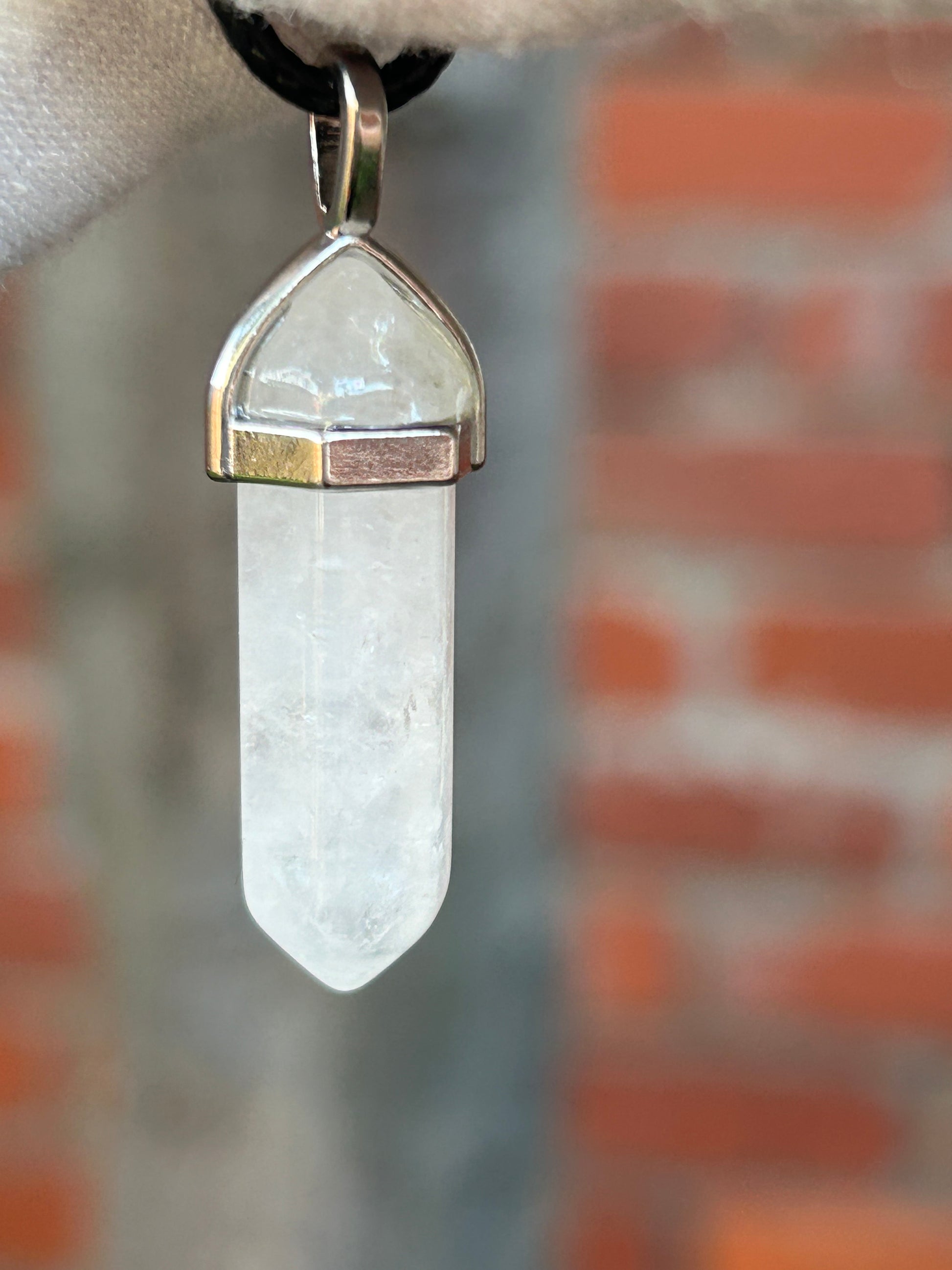 White Quartz Crystal Polished Point Pendant in silver setting and with black cord necklace