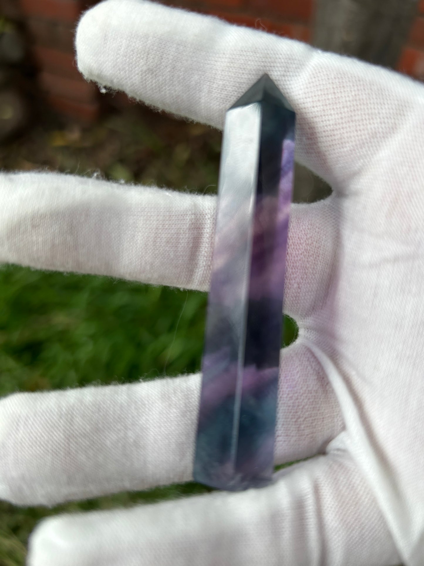 Rainbow fluorite crystal point purple pink green tones