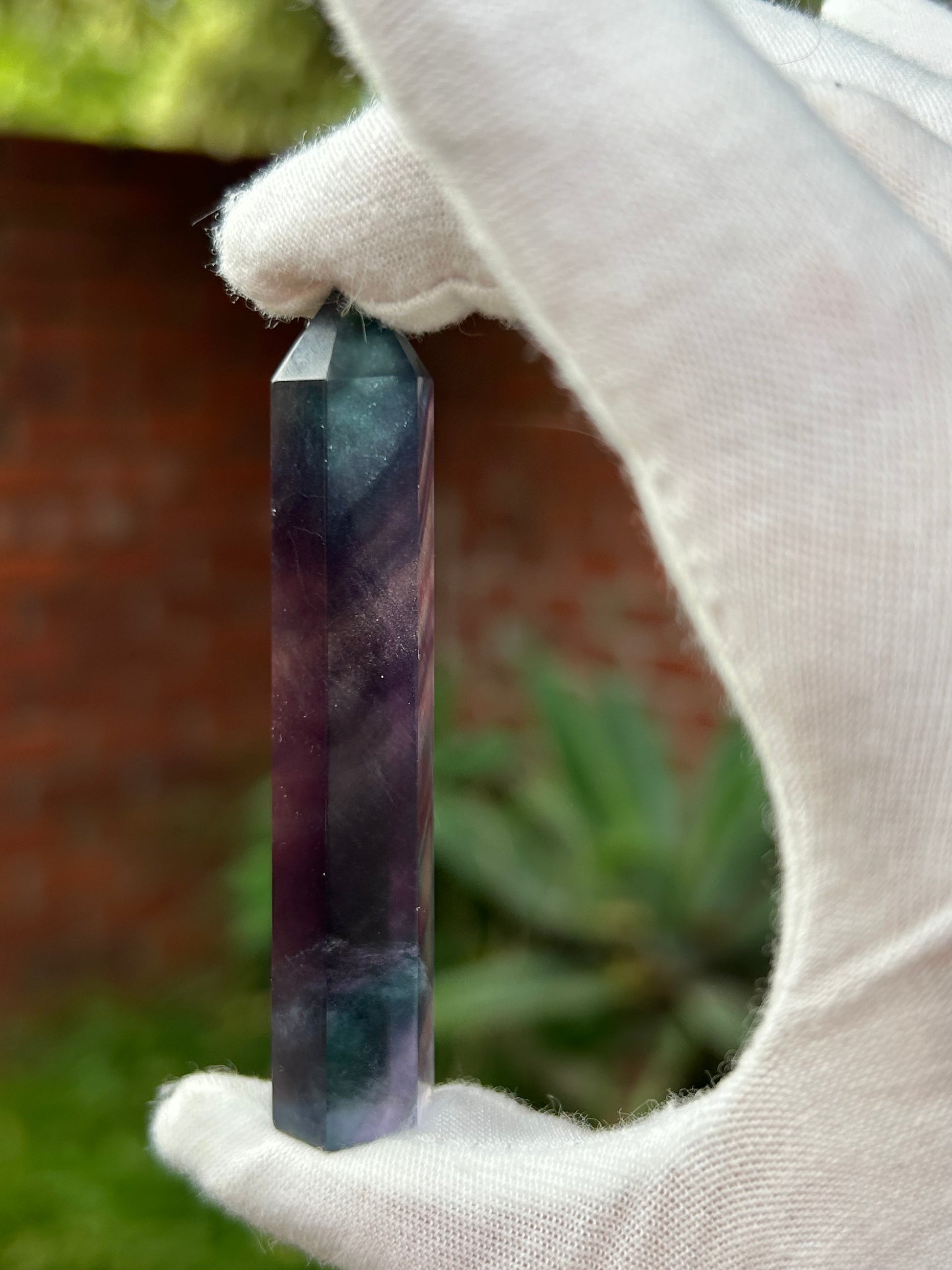 Rainbow fluorite crystal point purple pink green tones