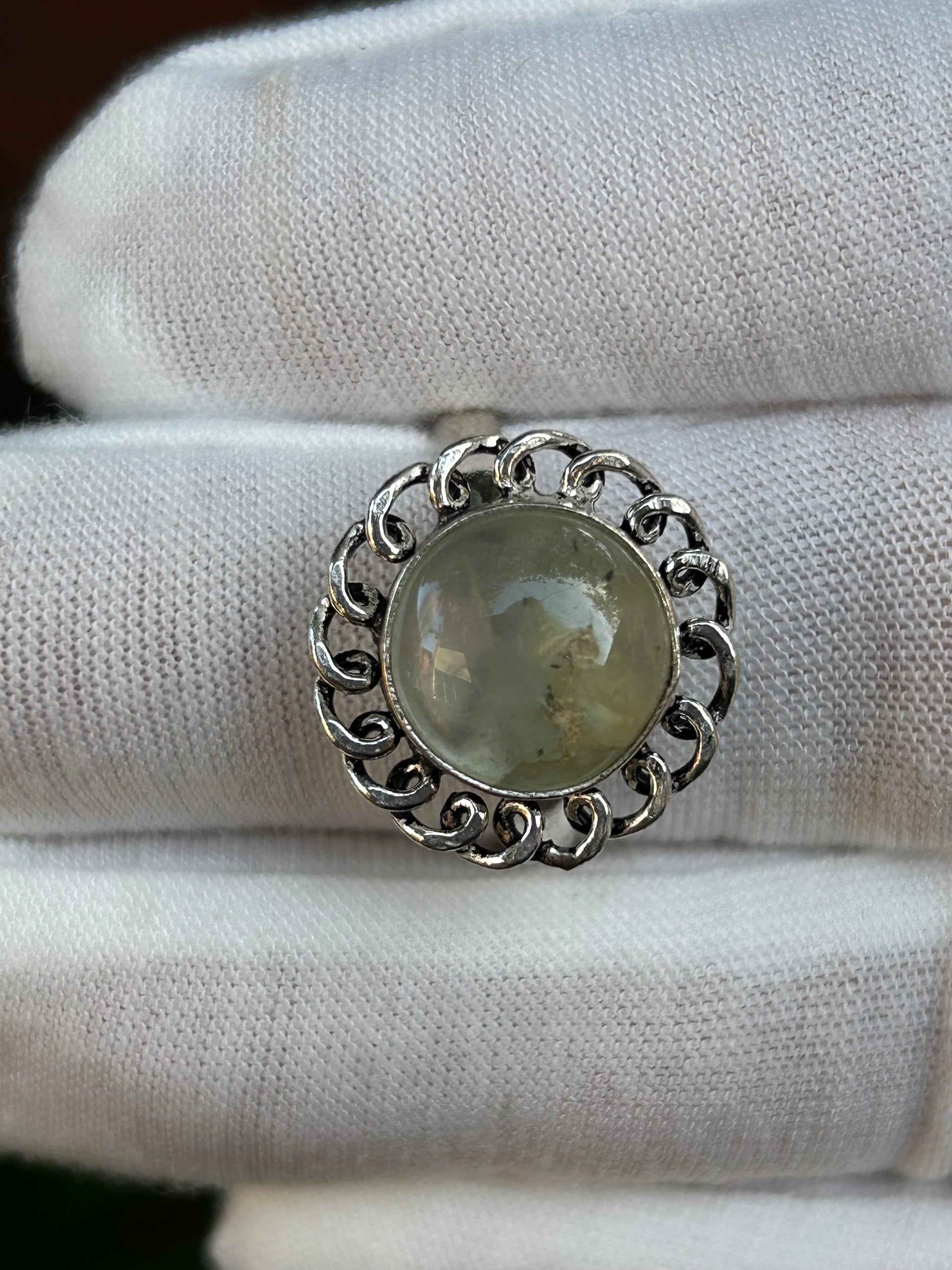 Prehnite silver ring with intricate design