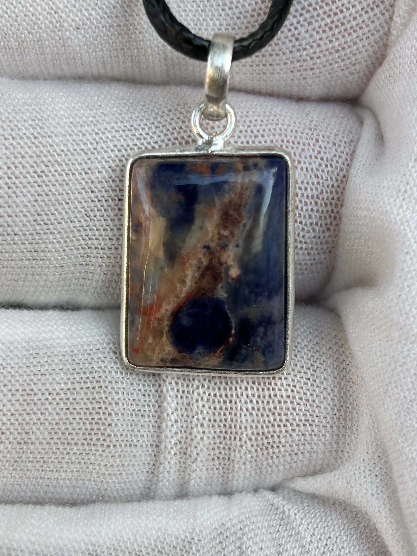 Sodalite blue cream brown square pendant set in sterling silver with black cord necklace