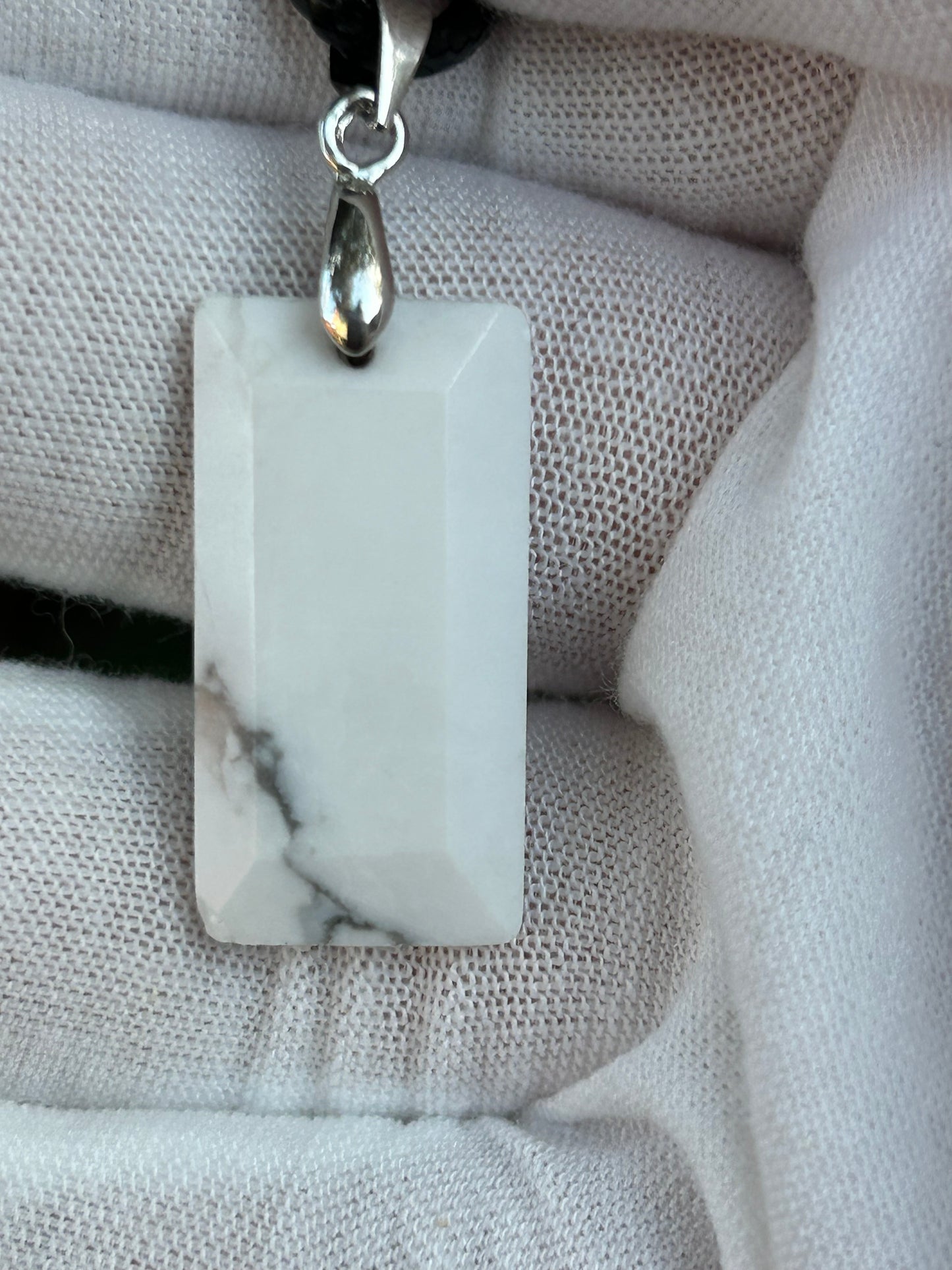 Howlite Rectangular Polished Pendant with silver pendant attachment and black cord necklace