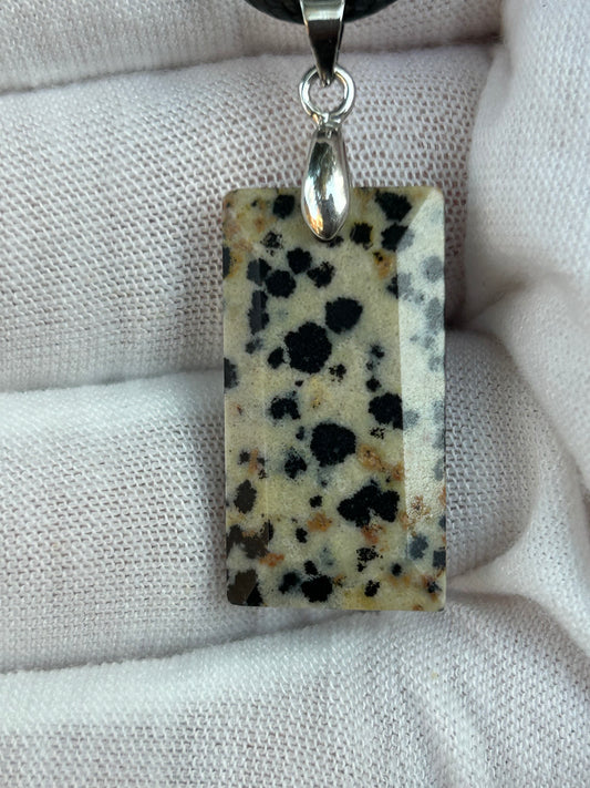 Dalmatian Jasper Polished rectangular pendant with silver pendant attachment and black cord necklace