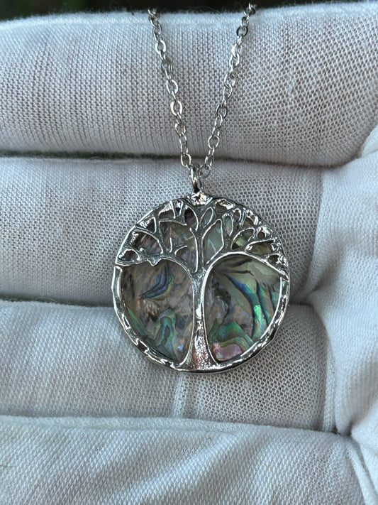 Tree of life silver pendant with paua abalone shell background and silver chain necklace