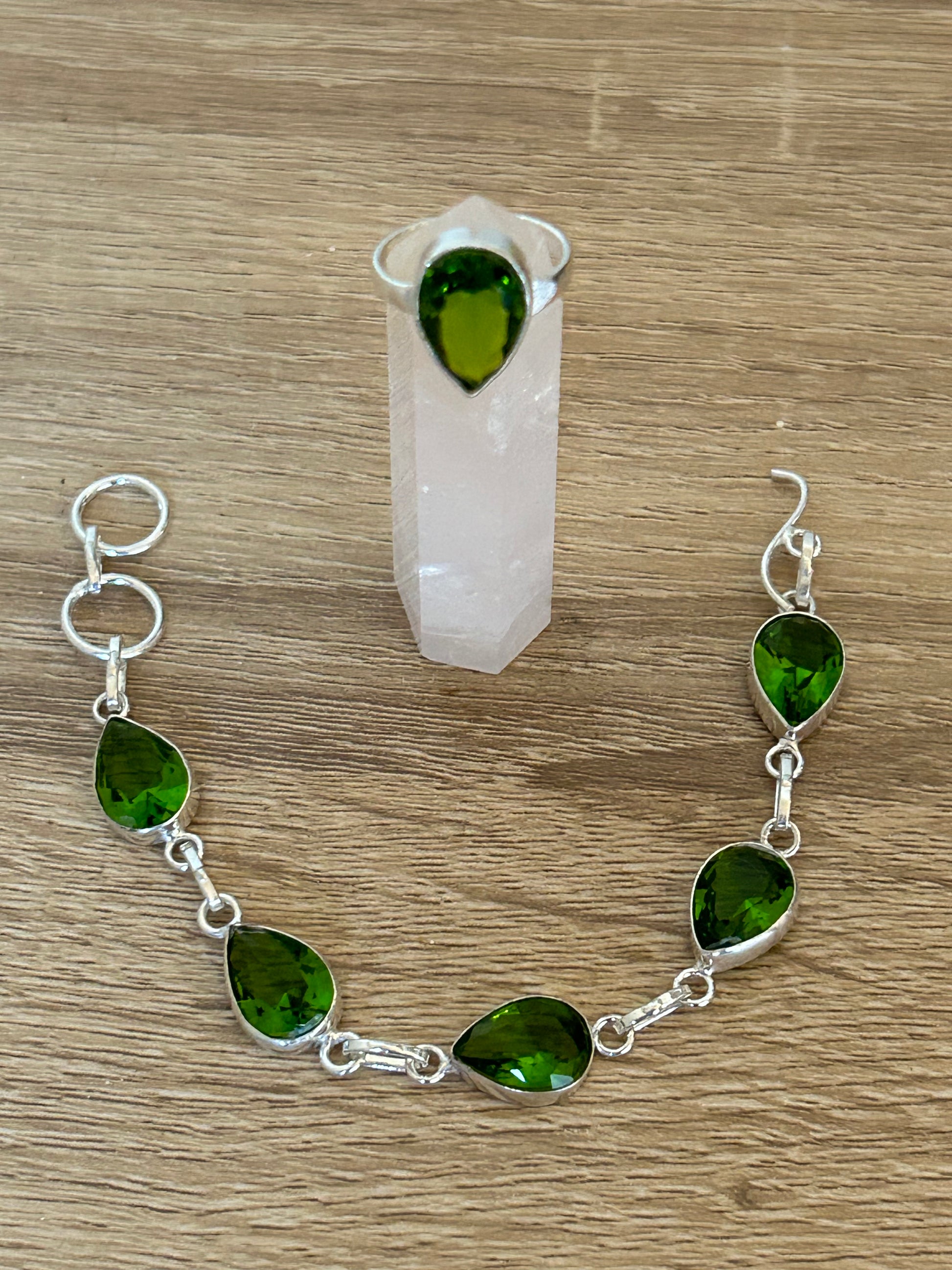 Green Peridot and 925 Sterling Silver Bracelet and Ring Set. The bracelet has 6 faceted water drop cut gems and the ring has one