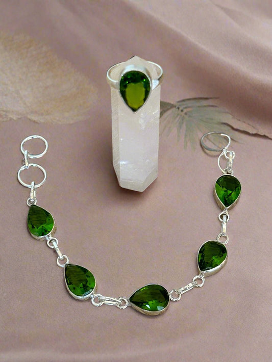 Green Peridot and 925 Sterling Silver Bracelet and Ring Set. The bracelet has 6 faceted water drop cut gems and the ring has one