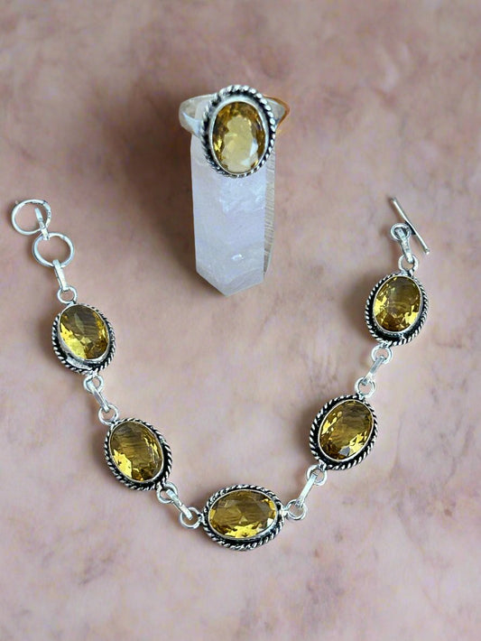 Faceted Citrine and 925 Sterling Silver Bracelet and Ring Set. The bracelet contains 5 large citrine gems and the ring one