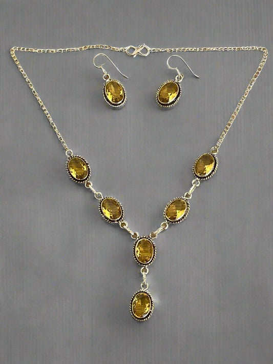 Citrine and 925 silver earrings and necklace set.  necklace has six faceted citrine gems and the earrings have one  faceted citrine each